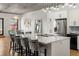Modern kitchen features a large island, stainless steel appliances, and sleek white cabinetry at 1499 Blake St # 3M, Denver, CO 80202