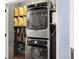 Convenient laundry area with a stacked washer and dryer at 1499 Blake St # 3M, Denver, CO 80202