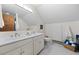 Elegant bathroom featuring double sinks, ample counter space, and sleek marble flooring at 32462 Lodgepole Dr, Evergreen, CO 80439