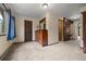 Neutral bedroom featuring carpet, wood trim and doors, and an antique-style dresser at 32462 Lodgepole Dr, Evergreen, CO 80439