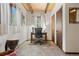 Bright, carpeted home office with desk, chair, and view from the window at 32462 Lodgepole Dr, Evergreen, CO 80439