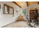 Bright office space featuring wood-trimmed windows and a wood bookcase at 32462 Lodgepole Dr, Evergreen, CO 80439