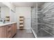 Clean bathroom, featuring a walk-in shower and double sinks at 1707 Julian St, Denver, CO 80204