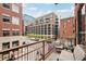 Balcony with a seating area overlooking a cityscape at 1801 Wynkoop St # 208, Denver, CO 80202