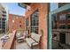 Charming balcony with seating, perfect for enjoying the urban view at 1801 Wynkoop St # 208, Denver, CO 80202