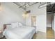 Bedroom featuring hardwood floors, neutral walls, closet with laundry facilities, and ensuite bathroom at 1801 Wynkoop St # 208, Denver, CO 80202