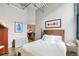 Bedroom features hardwood floors, neutral walls, and a doorway leading to another room at 1801 Wynkoop St # 208, Denver, CO 80202