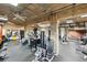 Gym with workout machines and equipment with brick and concrete accents at 1801 Wynkoop St # 208, Denver, CO 80202