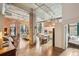 Open-concept living space with exposed brick, modern kitchen, and stylish furnishings, exuding urban elegance at 1801 Wynkoop St # 208, Denver, CO 80202