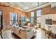 Cozy living room with large windows, exposed brick, and contemporary furniture, offering a comfortable and inviting atmosphere at 1801 Wynkoop St # 208, Denver, CO 80202