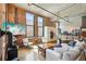 Inviting living area featuring exposed brick, contemporary decor, and a modern kitchen, perfect for stylish urban living at 1801 Wynkoop St # 208, Denver, CO 80202