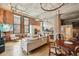 Chic living room showcasing exposed brick, large windows, and modern furnishings, offering a sophisticated and stylish urban lifestyle at 1801 Wynkoop St # 208, Denver, CO 80202