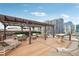 Stylish rooftop deck with shaded lounge areas and panoramic city views at 1801 Wynkoop St # 208, Denver, CO 80202