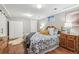 Spacious bedroom with hardwood floors, complemented by stylish furnishings and ample natural light at 2663 King St, Denver, CO 80211