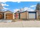 View of the property's detached garage, sheds, and backyard at 2663 King St, Denver, CO 80211