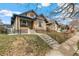 Beautifully maintained brick home with a well-manicured front yard at 2663 King St, Denver, CO 80211