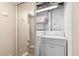 A bright laundry closet featuring a washer and dryer with a view into another area at 2663 King St, Denver, CO 80211
