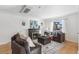 Bright and airy living room with a fireplace and large windows at 2663 King St, Denver, CO 80211