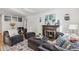 Comfortable living room featuring a stone fireplace and stylish decor at 2663 King St, Denver, CO 80211