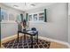 Bright office space has modern desk, decor, natural light, and patterned rug at 2663 King St, Denver, CO 80211