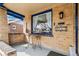 Cozy front porch with seating area and charming architectural details at 2663 King St, Denver, CO 80211