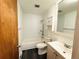 Functional bathroom featuring vinyl flooring, shower-tub, and a vanity for all your storage needs at 6040 W Elmhurst Dr, Littleton, CO 80128
