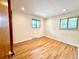 Bedroom with hardwood floors, natural light, and a neutral color scheme at 6040 W Elmhurst Dr, Littleton, CO 80128