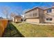 Exterior backyard featuring a lawn, landscaping, and upper deck at 10142 Josephine St, Thornton, CO 80229