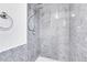 Modern shower room with gray tiled walls and a rainfall shower head at 10142 Josephine St, Thornton, CO 80229