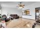 Spacious living room features hardwood floors and seamlessly connects to the kitchen area at 10142 Josephine St, Thornton, CO 80229