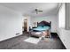 Spacious main bedroom with a ceiling fan, ample natural light, and an ensuite bathroom at 10142 Josephine St, Thornton, CO 80229