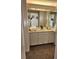 Clean bathroom featuring a large mirror and ample cabinet space at 2008 S Hannibal St # A, Aurora, CO 80013