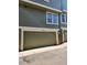 View of the attached garage with a gray door, white trim, and the address number above the garage door at 2008 S Hannibal St # A, Aurora, CO 80013