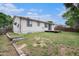 Spacious backyard with wooden deck and a view of the home at 2832 S Mobile St, Aurora, CO 80013