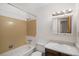 Traditional bathroom featuring a bathtub and vanity with good lighting at 2832 S Mobile St, Aurora, CO 80013