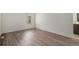 Neutral bedroom with hardwood-style floors and a bright window at 2832 S Mobile St, Aurora, CO 80013