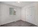 Clean bedroom showcasing hardwood-style floors and a large closet at 2832 S Mobile St, Aurora, CO 80013