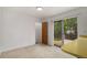 Bright dining area with sliding glass door leading to a deck and backyard at 2832 S Mobile St, Aurora, CO 80013