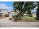 Charming single-story home featuring an attached garage and a well-maintained front yard with mature tree at 2832 S Mobile St, Aurora, CO 80013