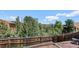 This backyard offers a wooden fence and tree-lined views at 30819 Hilltop Dr, Evergreen, CO 80439