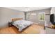 Serene bedroom with wooden headboard, bright windows, and modern decor at 30819 Hilltop Dr, Evergreen, CO 80439