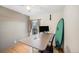 This office space features a desk, computer, surfboard, and neutral-colored walls for a cozy work environment at 30819 Hilltop Dr, Evergreen, CO 80439