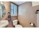 This half bathroom features modern fixtures, a window, and fresh paint at 5260 Morning Glory Pl, Highlands Ranch, CO 80130