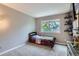 This bedroom features a twin bed, a window, and built-in shelves at 5260 Morning Glory Pl, Highlands Ranch, CO 80130