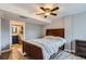 Bedroom with a full bathroom and nice ceiling fan at 5260 Morning Glory Pl, Highlands Ranch, CO 80130