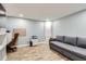 Home office features a couch that turns into a bed and tile flooring at 5260 Morning Glory Pl, Highlands Ranch, CO 80130