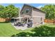 Inviting backyard patio featuring a dining set, grill, and comfortable outdoor seating area perfect for entertaining at 9673 Pinebrook St, Highlands Ranch, CO 80130
