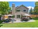 Expansive backyard featuring a patio, outdoor furniture, a grill, and lush lawn at 9673 Pinebrook St, Highlands Ranch, CO 80130