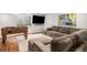 Finished basement featuring a sofa, rug, and Foosball table at 9673 Pinebrook St, Highlands Ranch, CO 80130