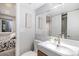Modern bathroom with a sink vanity, light fixture, and decorative mirror at 9673 Pinebrook St, Highlands Ranch, CO 80130